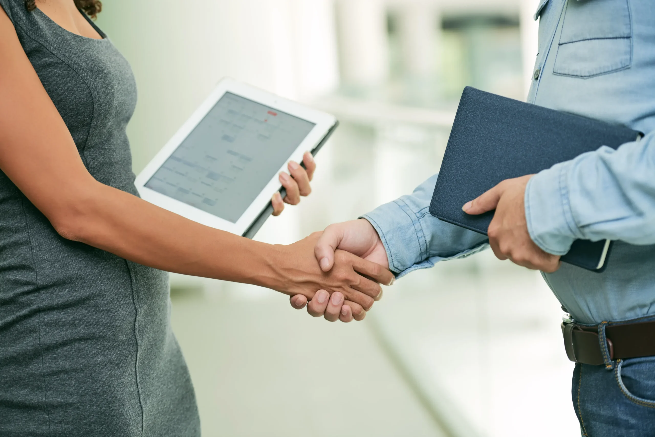 business-agreement-with-tablet-and-folder-handshak-2026-01-07-07-09-46-utc