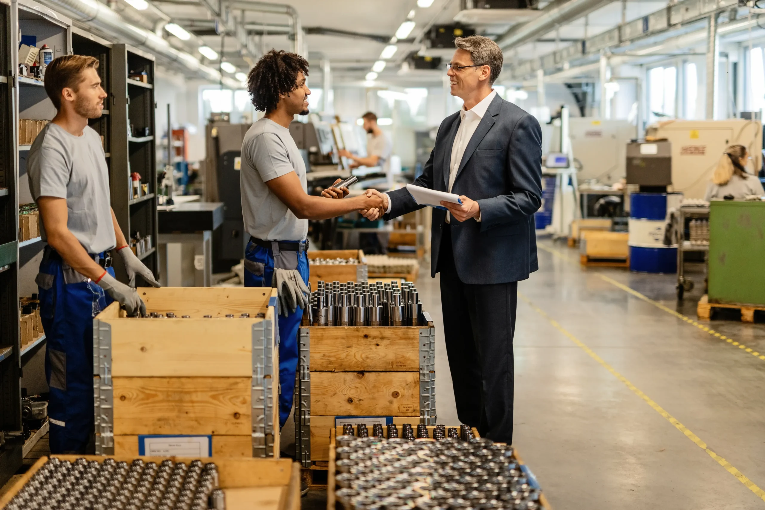 businessman-and-factory-worker-shaking-hands-2026-03-16-04-30-00-utc